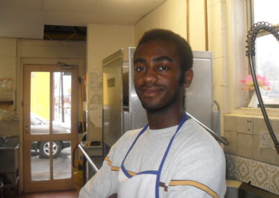 Volunteer helping with dishes